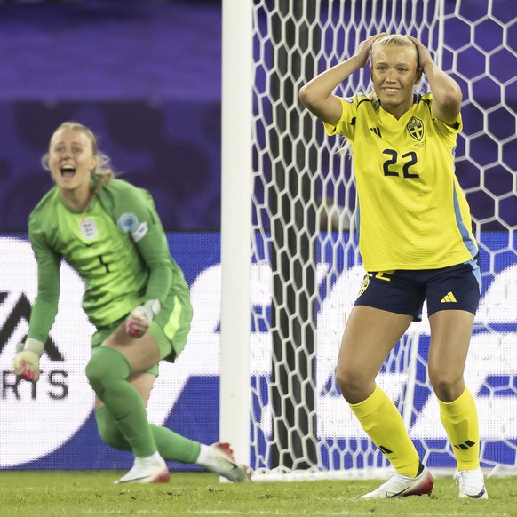 Sweden&#039;s Smilla Holmberg, reacts after missing as England&#039;s Hannah Hampton celebrates during a penalty shootout at the Women&#039;s Euro 2025 quarterfinals soccer match between Sweden and En ...