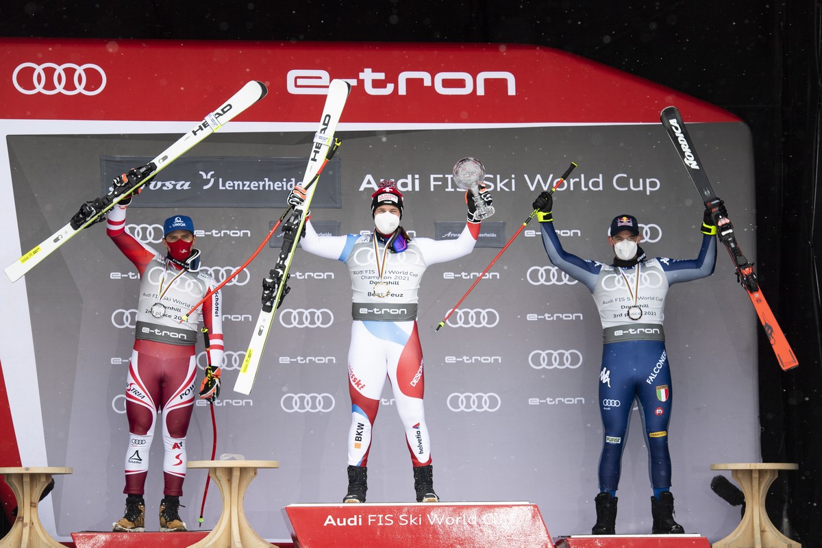 epa09079561 (L-R) Second placed Matthias Mayer of Austria, winner Beat Feuz of Switzerland and third placed Dominik Paris of Italy during the award ceremony for the crystal globe of the men's dow ...