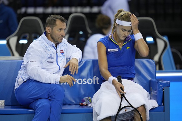 Anna Karolina Schmiedlova of Slovakia, right, sits next her captain Matej Liptak, during the first day match of the Billie Jean King Cup finals at Emirates Arena in Glasgow, Tuesday, Nov. 8, 2022. (AP ...