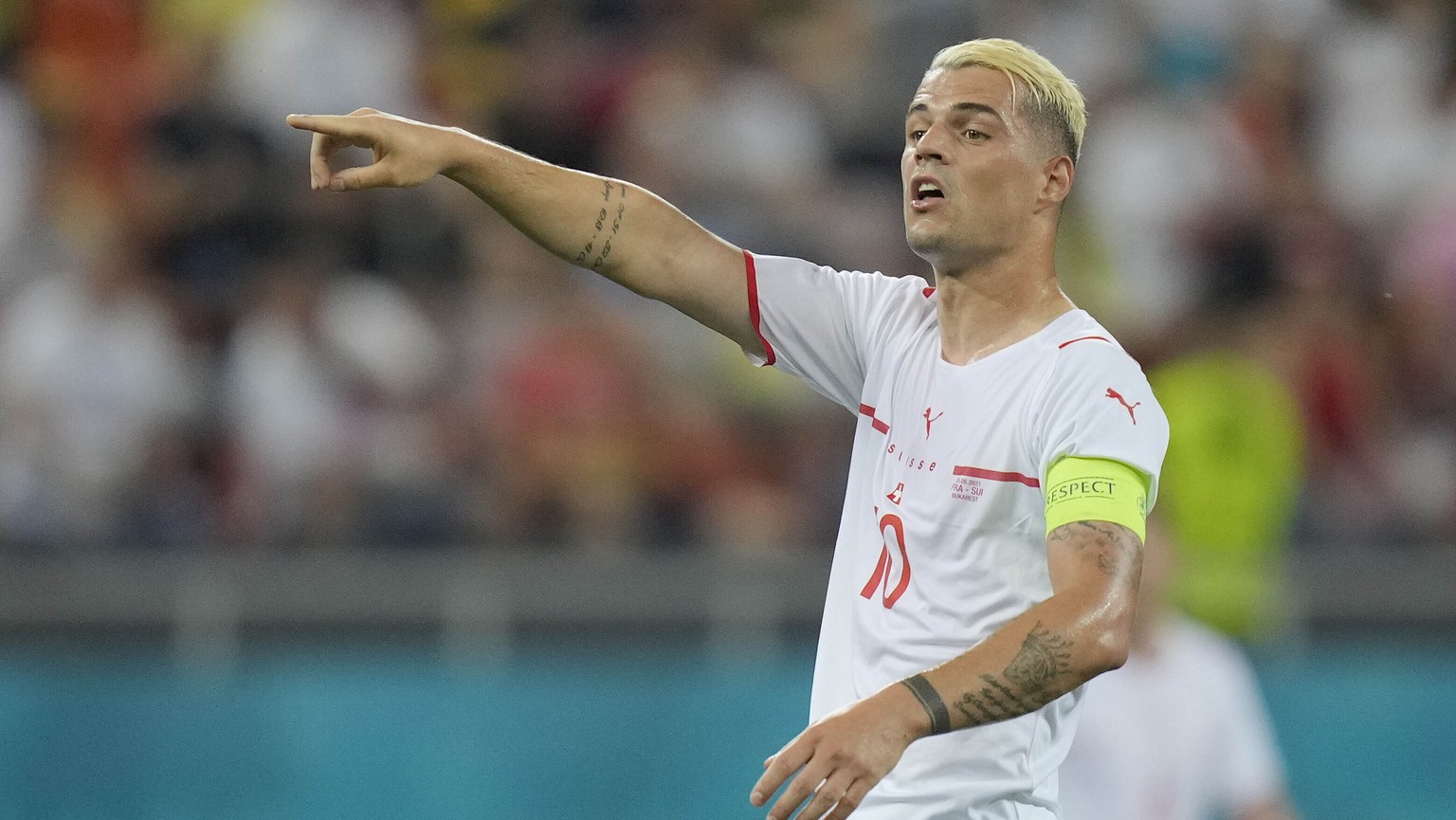 Switzerland&#039;s Granit Xhaka gestures during the Euro 2020 soccer championship round of 16 match between France and Switzerland at the National Arena stadium in Bucharest, Romania, Monday, June 28, ...