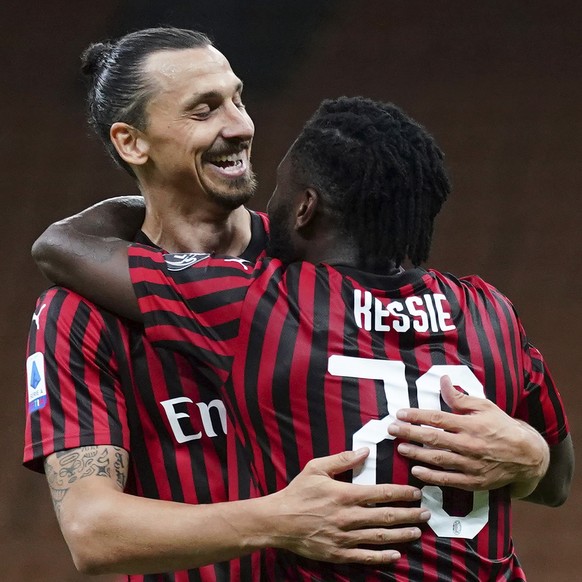 AC Milan&#039;s Franck Kessie, right, celebrates with Zlatan Ibrahimovic after scoring his side&#039;s 2nd goal during the Serie A soccer match between AC Milan and Juventus at the Milan San Siro Stad ...