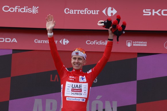 epa13197191 Slovenian rider Tadej Pogacar of UAE Emirates team reacts after retaining the red overall leader jersey following the 7th stage of the La Vuelta a Espana cycling tour, a race over 149.8km  ...