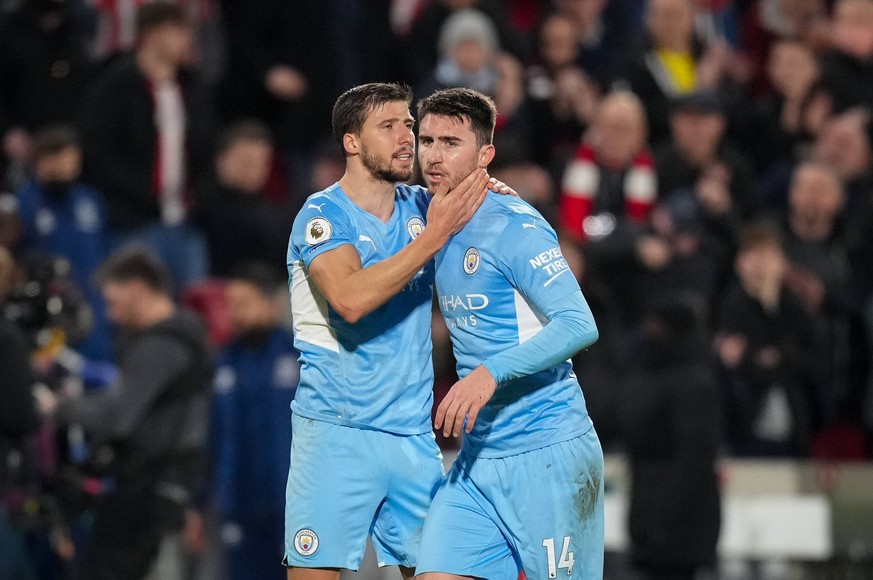 Aymeric Laporte right and Ruben Dias of Man City during the Premier League match between Brentford and Manchester City at the Brentford Community Stadium, Brentford, England on 29 December 2021. PUBLI ...
