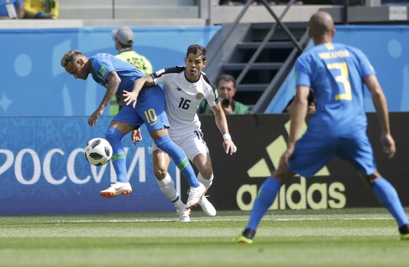 Brazil&#039;s Neymar, left, challenges for the ball with Costa Rica&#039;s Cristian Gamboa, during the group E match between Brazil and Costa Rica at the 2018 soccer World Cup in the St. Petersburg St ...