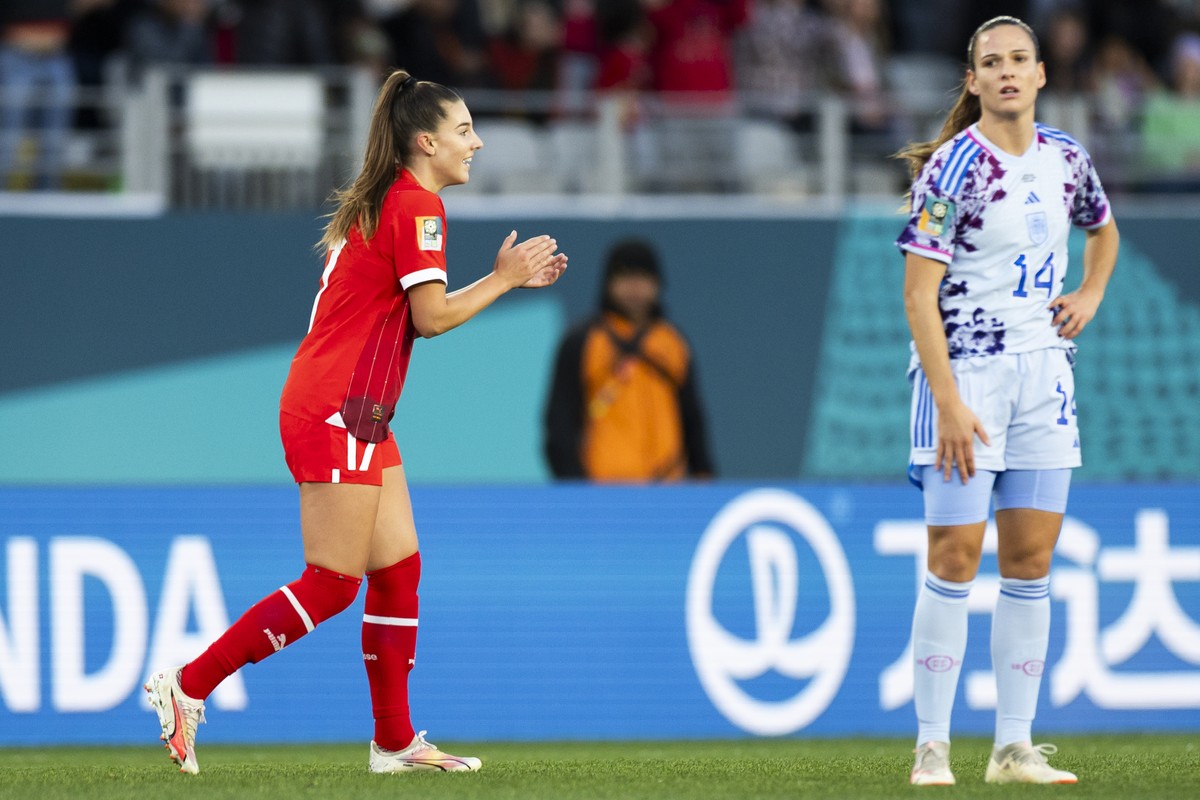 Switzerland's midfielder Seraina Piubel, left, and Spain's defender Laia Codina react after spain scored a own goal to 1-1 during the FIFA Women's World Cup 2023 round of 16 soccer matc ...