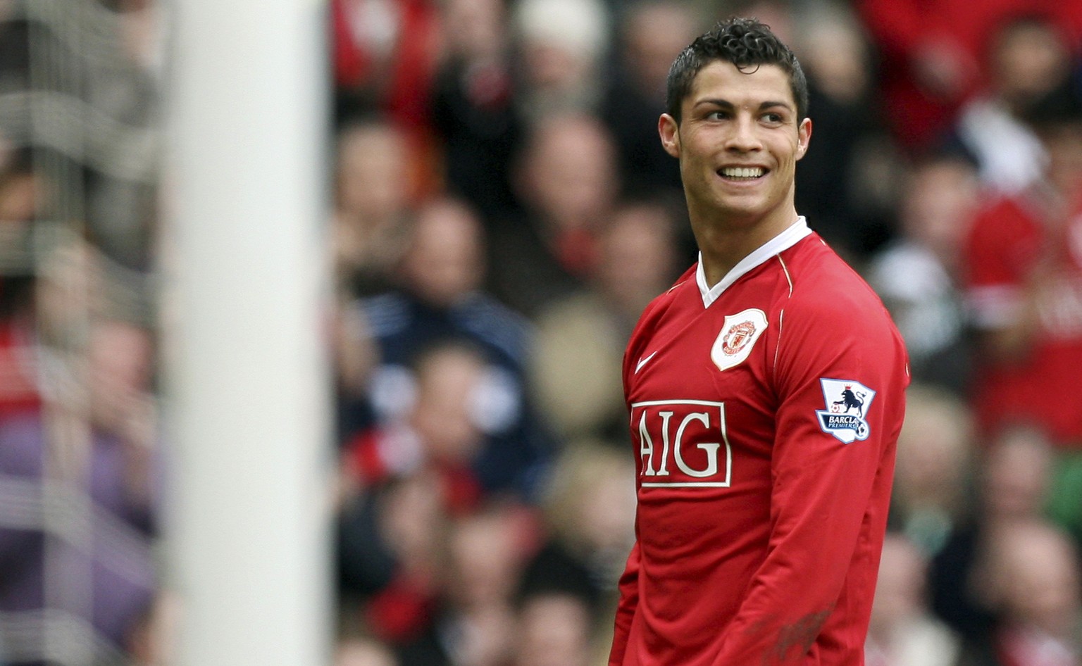 FILE - In this March 17, 2007, file photo, Manchester United&#039;s Cristiano Ronaldo smiles during his team&#039;s 4-1 win over Bolton Wanderers in their English Premier League soccer match at Old Tr ...