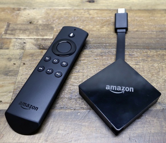 FILE - This Wednesday, Sept. 27, 2017, file photo shows an Amazon Fire TV streaming device with its remote control. On Tuesday, Dec. 5, 2017, Google announced plans to pull its popular YouTube video s ...