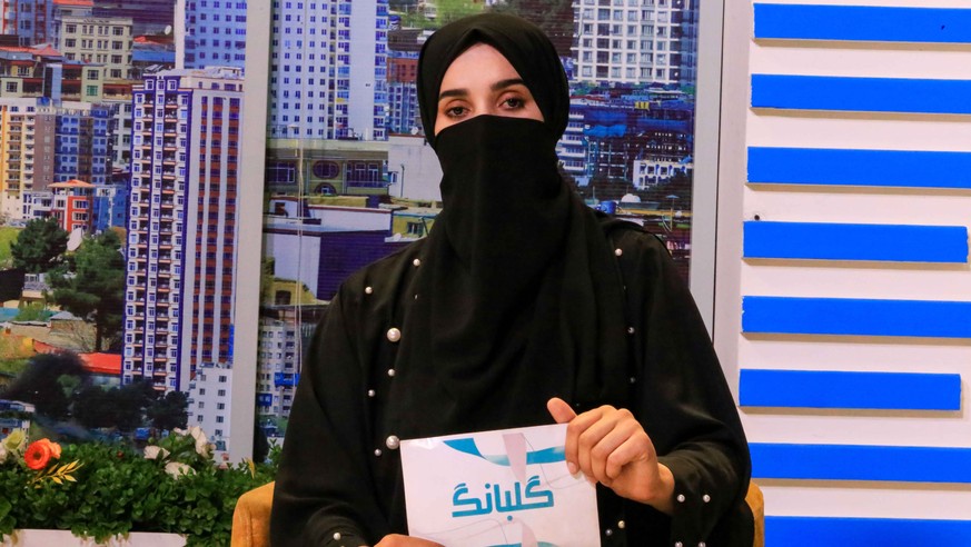 epa10085251 Shgofe, an Afghan female newscaster during a program at private channel 1 TV in Kabul, Afghanistan, 21 July 2022. Female television presenters and reporters in Afghanistan continue to appe ...