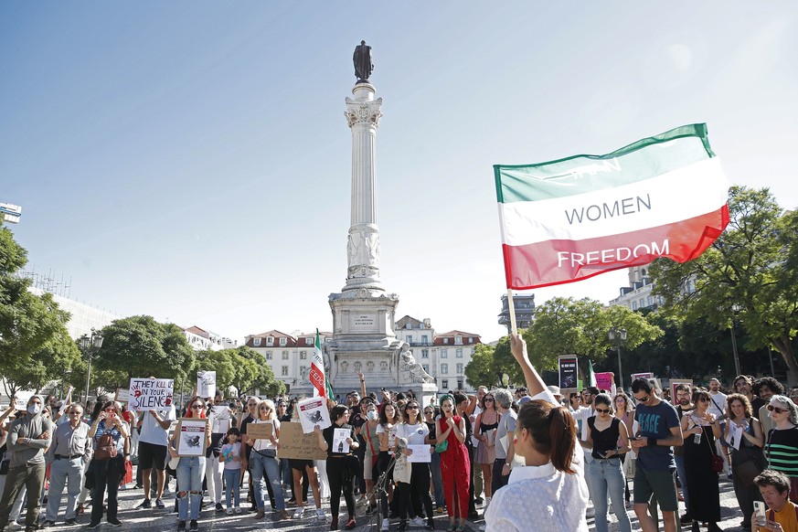 epa10218132 Iranian activists demonstrate during a sit-in at Rossio Square in solidarity with women in Iran, in Lisbon, Portugal, 01 October 2022. Since the death of Mahsa Amini, a 22-year-old Iranian ...