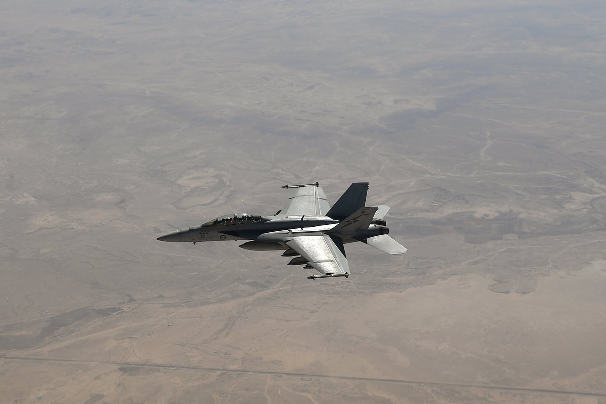 epa06198976 A Royal Australian Air Force (RAAF) F/A-18F Super Hornet is seen after refuelling from a RAAF KC-30A Multi-Role Tanker in the skies over central Iraq during an air operation in the Middle  ...
