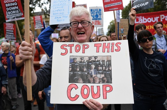 epa07825825 People protest against the government of British Prime Minister Boris Johnson, in London, Britain, 07 September 2019. The event &#039;Demand Democracy: Johnson Out! #StopTheCoup&#039; call ...