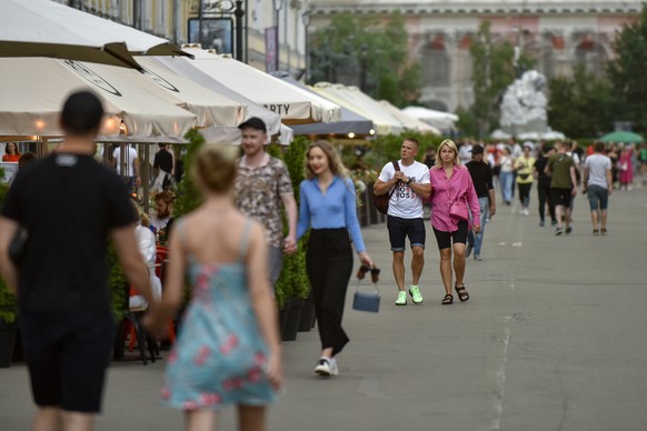 epa10035822 People walk on a street in Kyiv (Kiev), Ukraine, 26 June 2022. Multiple airstrikes hit the center of Kyiv in the morning. Russian troops entered Ukraine on 24 February resulting in fightin ...