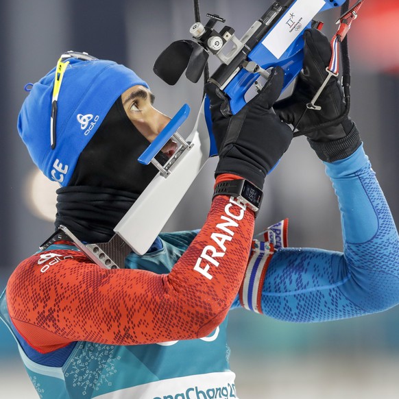 Martin Fourcade, of France, looks over his rifle barrel before the start of the men&#039;s 10-kilometer biathlon sprint at the 2018 Winter Olympics in Pyeongchang, South Korea, Sunday, Feb. 11, 2018.  ...