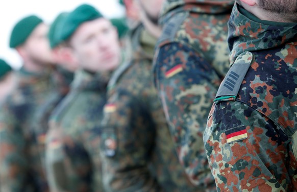 Soldiers of the German armed forces Bundeswehr take part in farewell ceremony for mechanized infantry Panzergrenadierbataillon 122, to be deployed in Lithuania, in Oberviechtach, Germany January 19, 2 ...