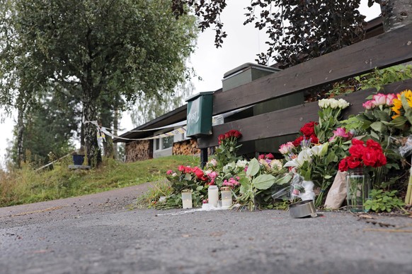 epa07769561 Flowers outside the home of 17-year old stepsister of suspected Mosque attacker in Barum (Baerum) outside Oslo, Norway, 12 August 2019. A 21-year-old Norwegian man is set to face court on  ...