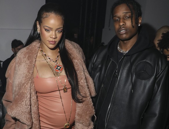 FILE - Rihanna, left, pregnant with her first child, and ASAP Rocky arrive for the Off-White Ready To Wear Fall/Winter 2022-2023 fashion collection, unveiled during the Fashion Week in Paris, on Feb.  ...