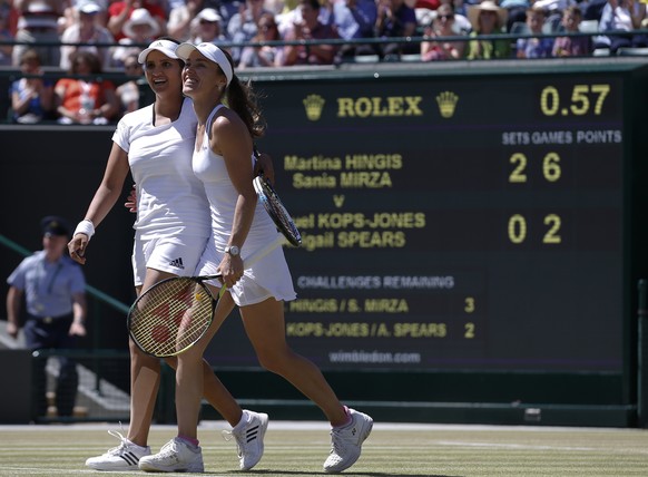 Martina Hingis of Switzerland,second left, celebrates with partner Sania Mirza of India as they win their women&#039;s semifinal doubles match against Raquel Kops-Jones of the United States and Abigai ...