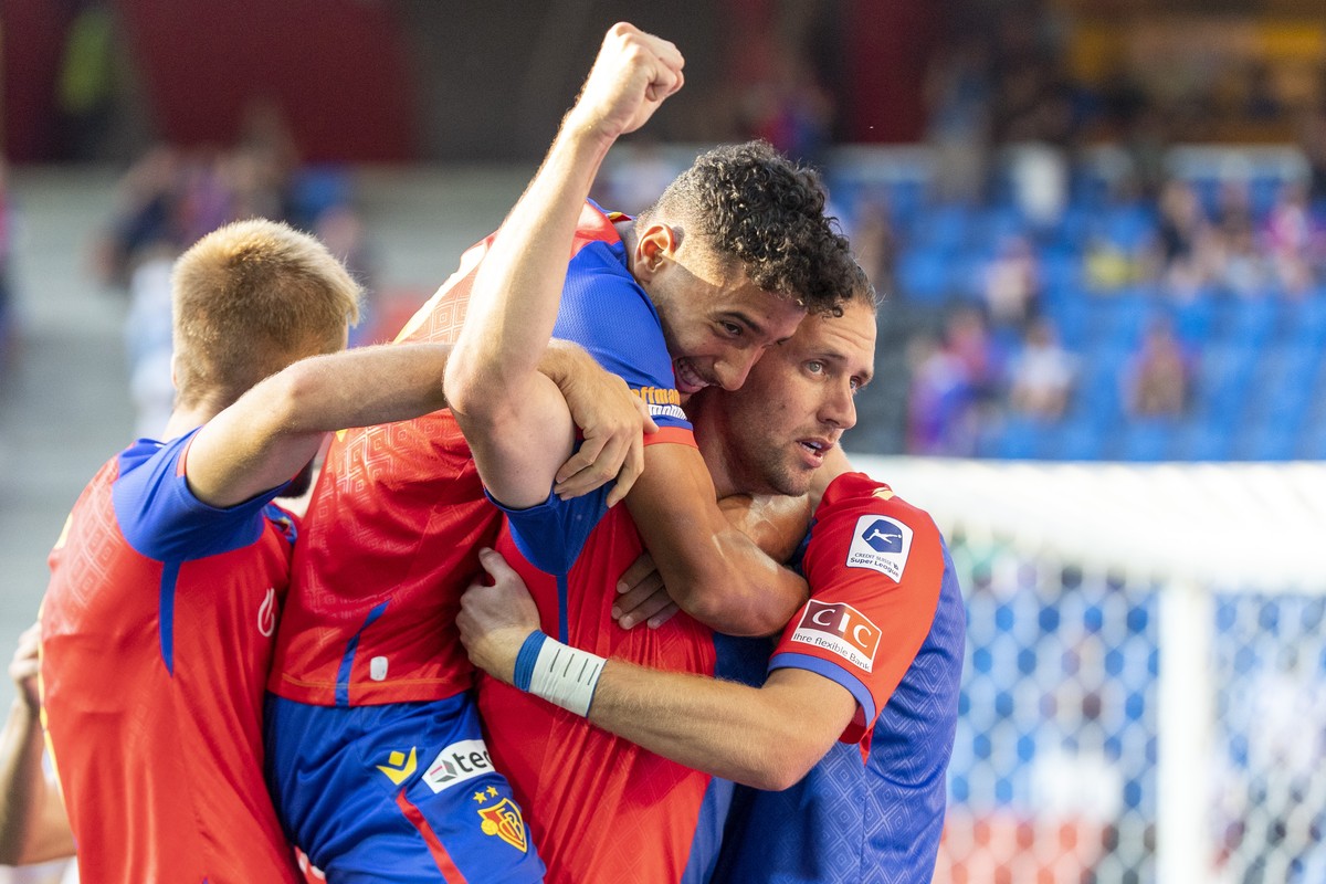Basel's Arnau Comas, Sayfallah Ltaief and Adam Szalai, from left, cheer after scoring during the UEFA Conference League second qualifying round first leg match between Switzerland's FC Basel ...