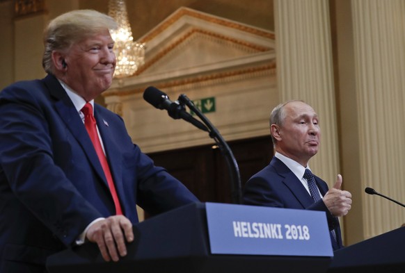 Russian President Vladimir Putin, right, and U.S. President Donald Trump give a joint news conference at the Presidential Palace in Helsinki, Finland, on Monday, July 16, 2018. (AP Photo/Pablo Martine ...