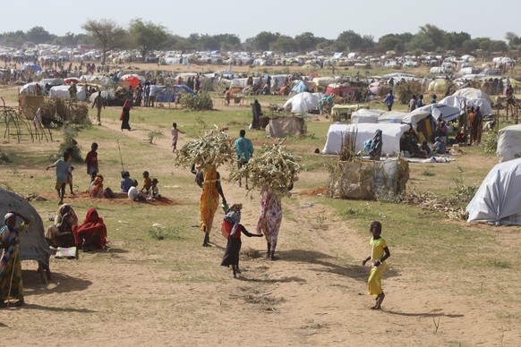 Sudanese refugees who fled the conflict in Sudan gather July 1, 2023 at the Zabout refugee Camp in Goz Beida, Chad. The U.N. says the conflict in Sudan has driven more than 3.1 million people from the ...