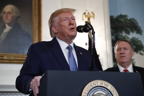 President Donald Trump, accompanied by Secretary of State Mike Pompeo, speaks Wednesday, Oct. 23, 2019, in the Diplomatic Room of the White House in Washington. (AP Photo/Jacquelyn Martin)
Donald Trum ...