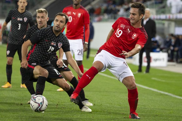 Croatia&#039;s midfielder Milan Badelj, left, fights for the ball with Switzerland&#039;s forward Mario Gavranovic, right, during an international friendly test match between the the national soccer t ...
