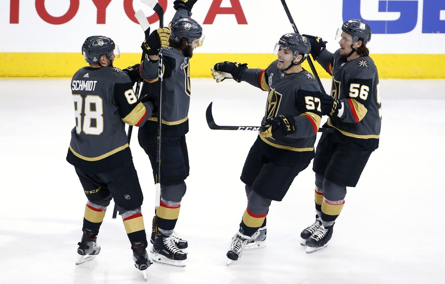 Vegas Golden Knights defenseman Colin Miller, second from left, celebrates his goal with defenseman Nate Schmidt, left, left wing David Perron, second from right, and left wing Erik Haula during first ...