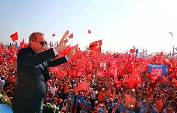 Turkish President Recep Tayyip Erdogan waves to the crowd during a Democracy and Martyrs&#039; Rally in Istanbul, Sunday, Aug. 7, 2016. More than 1 million flag-waving Turks gathered in Istanbul on Su ...
