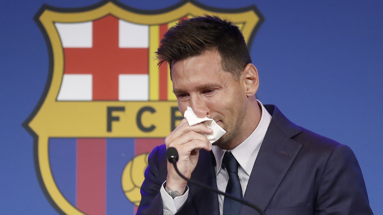 epa09405843 Argentine forward Lionel Messi gets emotional during a press conference to explain his version of the reasons for his departure from Barcelona FC in Barcelona, Spain, 08 August 2021. FC Ba ...