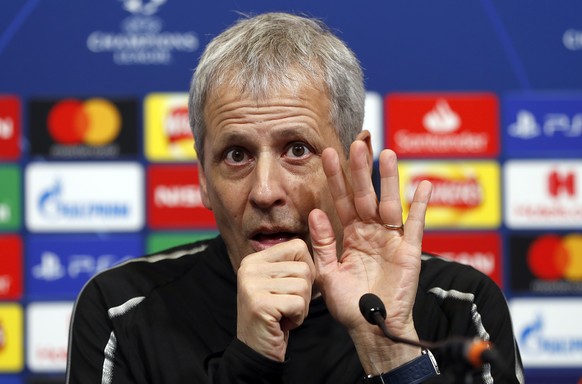 Dortmund coach Lucien Favre gestures during a press conference ahead of the Champions League round of 16 first leg soccer match between Tottenham Hotspur and Borussia Dortmund at Wembley Stadium in Lo ...