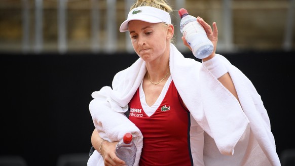 Jil Teichmann from Switzerland reacts after loosing against Maryna Zanevska from Belgium during the first round match at the WTA International Ladies Open Lausanne tournament, in Lausanne, Switzerland ...