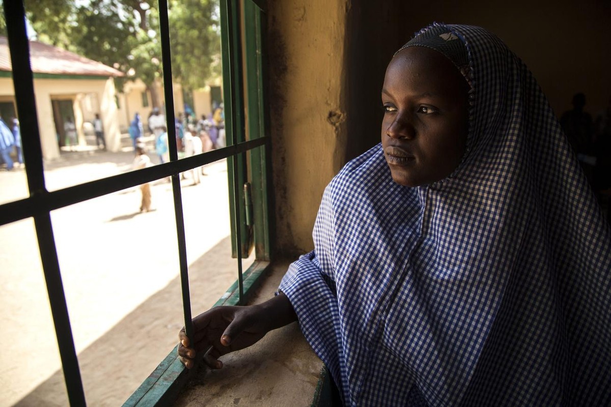 epa05666543 A handout picture provided by the United Nations Children's Fund (UNICEF) on 08 December 2016 shows a girl looking out of the window of her classroom at Dikwa Central Primary School,  ...