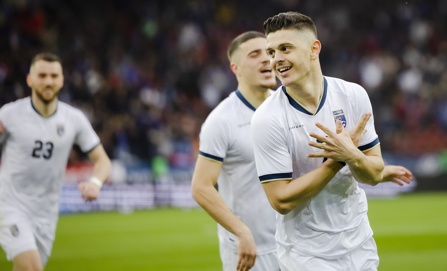 epa09858386 Kosovo&#039;s Milot Rashica (R) celebrates after scoring the 1-0 lead during the International Friendly soccer match between Switzerland and Kosovo in Zurich, Switzerland, 29 March 2022. E ...