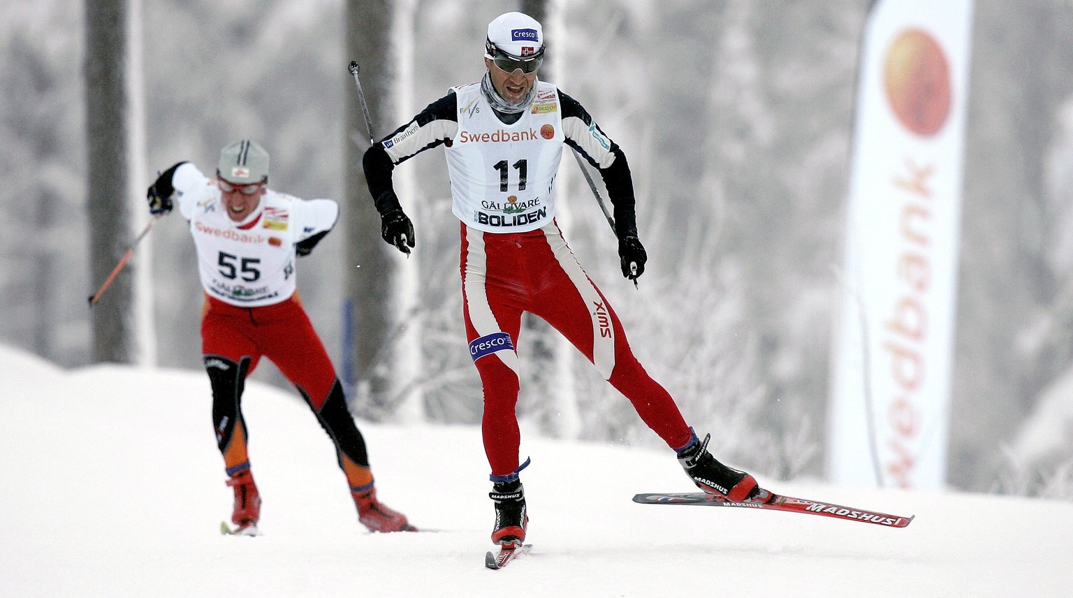 GAELLIVARE, SWEDEN - NOVEMBER 18: (FRANCE OUT) Ole Einar Bjoerndalen of Norway leads Christian Hoffmann of Austria during the the FIS Cross Country World Cup Men&#039;s 15KM event on November 18, 2006 ...