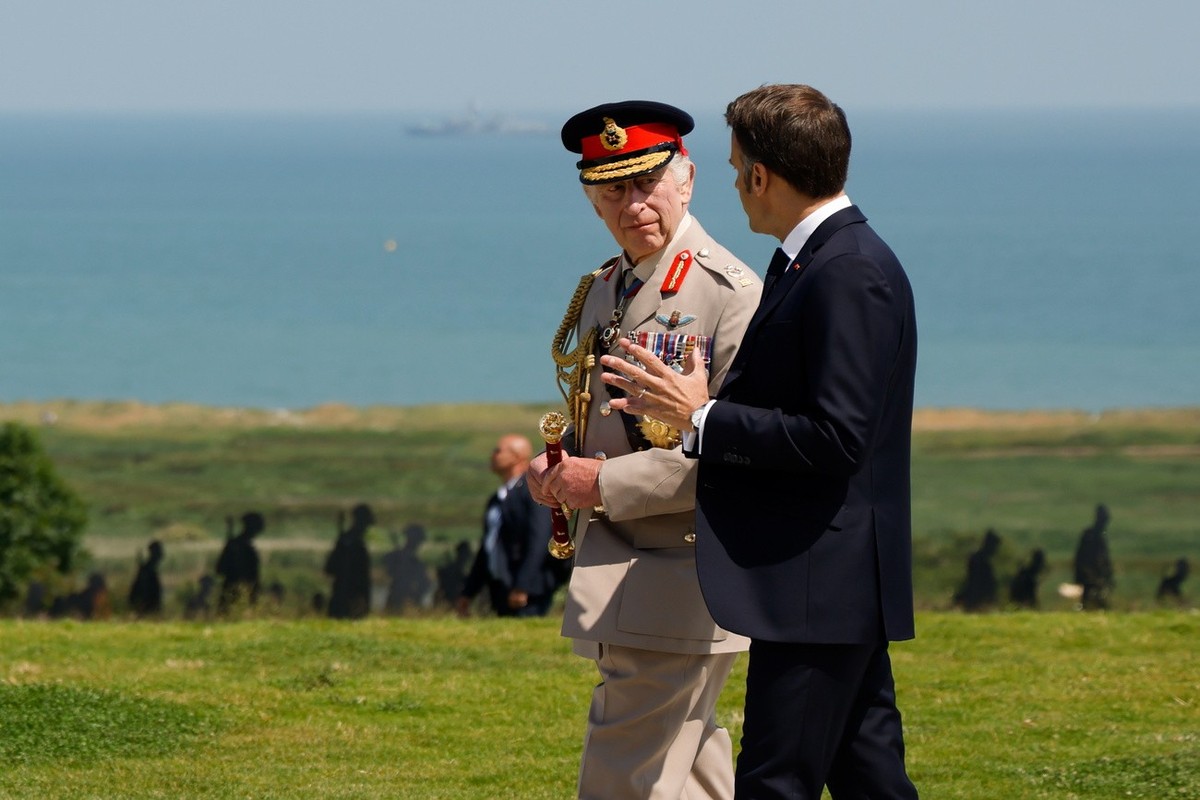epa11392928 Britain's King Charles III (L) and France's President Emmanuel Macron converse during the UK Ministry of Defence and the Royal British Legion��&amp;#x2122;s commemorative ceremon ...