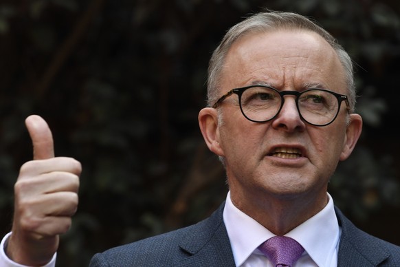 Leader of the center-left Australian Labor Party opposition Anthony Albanese speaks to the media during a press conference while campaigning in Adelaide, Friday, May 20, 2022. The son of a single moth ...