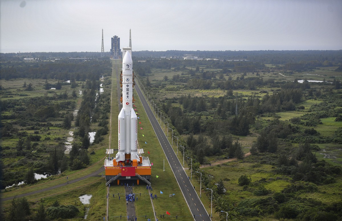 In this Nov. 17, 2020, photo released by China's Xinhua News Agency, a Long March-5 rocket is moved at the Wenchang Space Launch Site in Wenchang in southern China's Hainan Province. Chinese ...