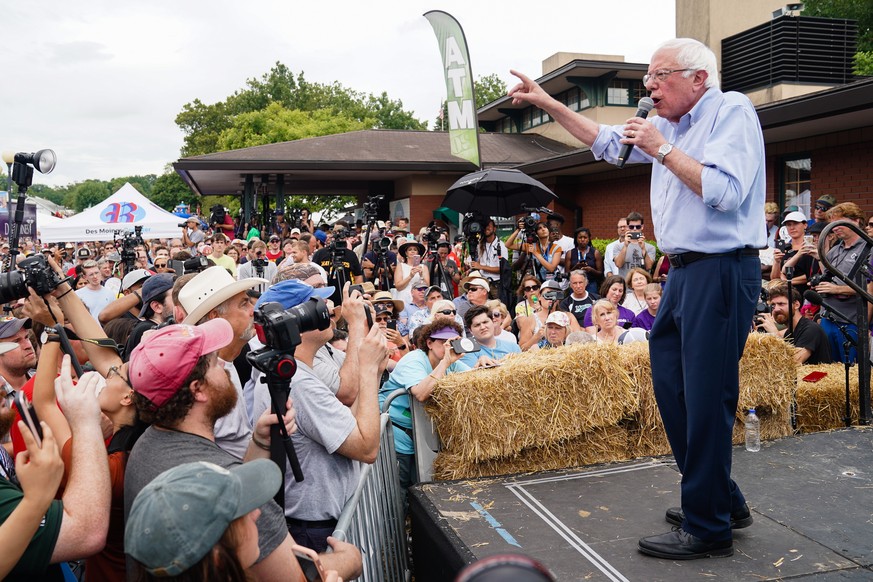 epa07769109 US Senator and Democratic presidential candidate Bernie Sanders (R) speaks on the Des Moines Register Political Soapbox at the Iowa State Fair in Des Moines, Iowa, USA, 11 August 2019. EPA ...