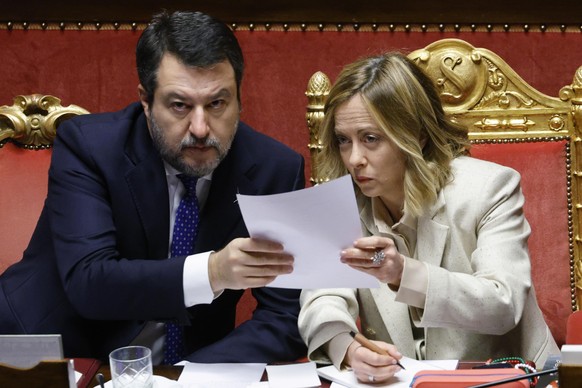 epa11783403 Italian Prime Minister Giorgia Meloni (R) speaks with Italian Deputy Prime Minister and Minister of Infrastructure and Transport Matteo Salvini during her report on the upcoming European C ...