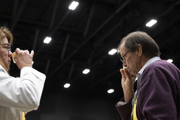 Members of the jury analyze and taste cheeses from different countries, during the 37th World Cheese Awards, at the Festhalle in Bern, Switzerland, November 13, 2025. More than 5,244 cheeses from 46 c ...