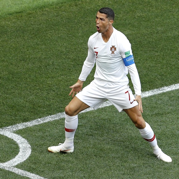 Portugal's Cristiano Ronaldo celebrates after scoring the opening goal during the group B match between Portugal and Morocco at the 2018 soccer World Cup in the Luzhniki Stadium in Moscow, Russia ...