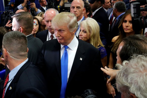 Republican U.S. presidential nominee Donald Trump talks to reporters in the spin room after his first debate against Democratic U.S. presidential nominee Hillary Clinton at Hofstra University in Hemps ...