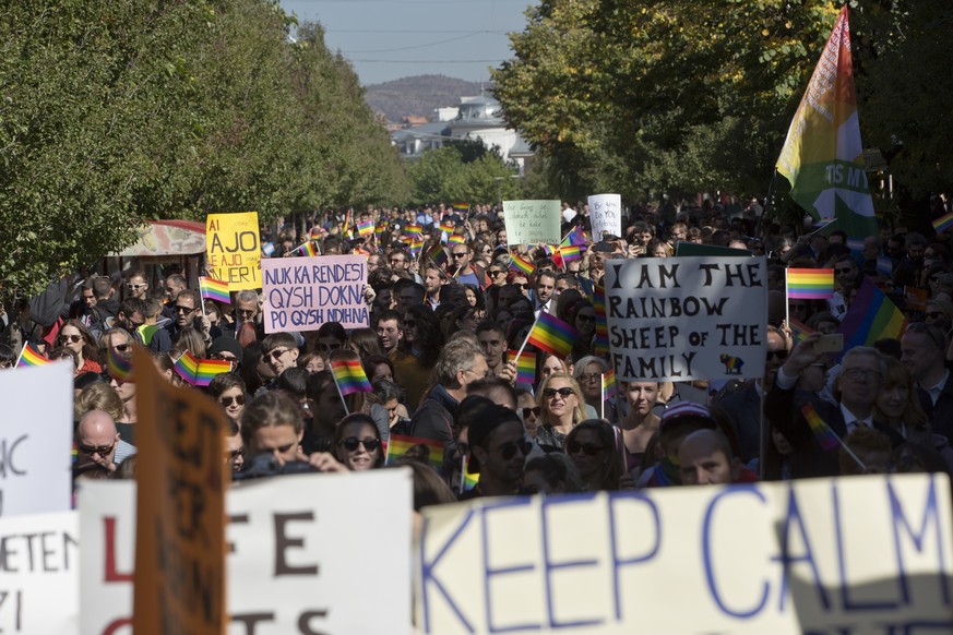 LGBT rights groups and supporters of the community hold banners during the country&#039;s first Gay Pride parade on Tuesday Oct. 10, 2017, in Kosovo&#039;s capital Pristina. (AP Photo/Visar Kryeziu)