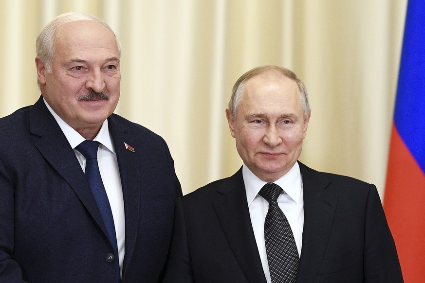 FILE - Russian President Vladimir Putin, right, and Belarusian President Alexander Lukashenko pose for a photo prior to their talks at the Novo-Ogaryovo state residence, outside Moscow, Russia, Feb. 1 ...