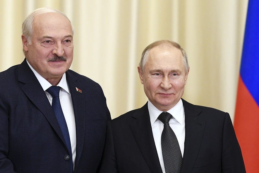 FILE - Russian President Vladimir Putin, right, and Belarusian President Alexander Lukashenko pose for a photo ahead of their talks at the Novo-Ogaryovo state residence, outside Moscow, Russia, Feb. 1...