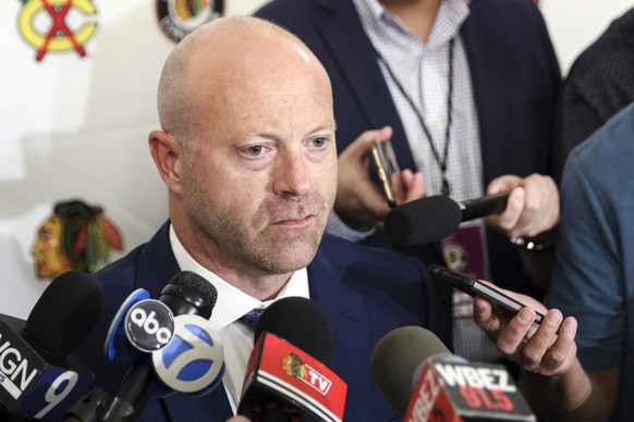 FILE- In this July 26, 2019, file photo, Chicago Blackhawks senior vice president and general manager Stan Bowman speaks to the media during the NHL hockey team&#039;s convention in Chicago. Bowman re ...