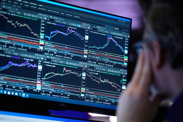 A screen displays financial information on the floor at the New York Stock Exchange in New York, Tuesday, March 31, 2026. (AP Photo/Seth Wenig)
Financial Markets Wall Street