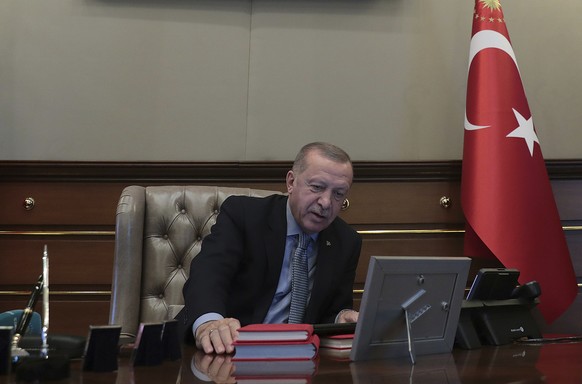 Turkey&#039;s President Recep Tayyip Erdogan speaks on the phone with Defense Minister Hulusi Akar before reportedly giving orders for the start of the military operation into Syria, in Ankara, Turkey ...