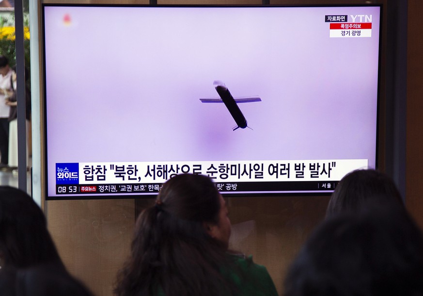 epa10761221 People watch a news report on a North Korean cruise missile launch at a station in Seoul, South Korea, 22 July 2023. According to South Korea&#039;s Joint Chiefs of Staff (JCS) North Korea ...