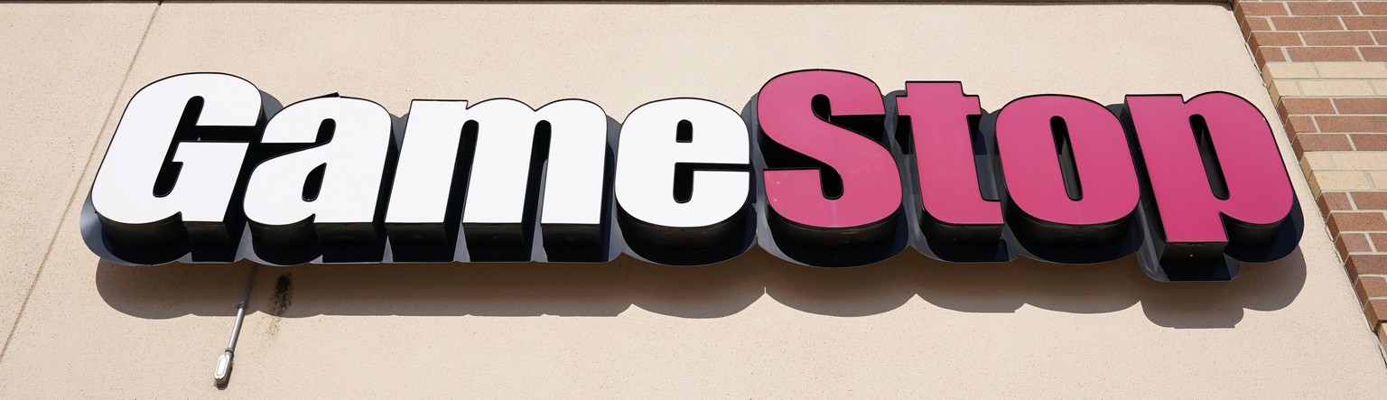 A GameStop sign is seen above a store, Thursday, Jan. 28, 2021, in Urbandale, Iowa. The online trading platform Robinhood is moving to restrict trading in GameStop and other stocks that have soared re ...